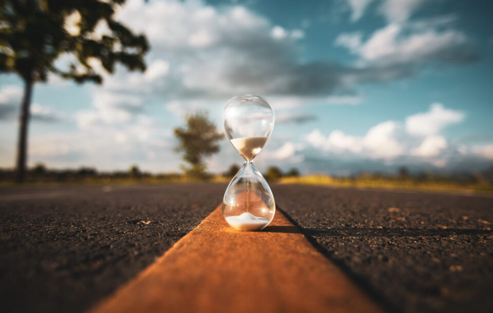 Hourglass,On,Open,Road,At,Sunset,Time.,Life,Time,Passing
